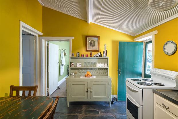 Cottage 8 — the cottage kitchen with oven, kettle and dining table