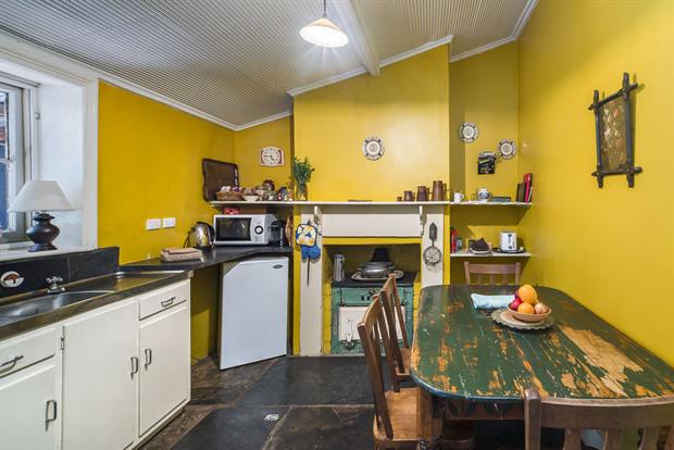 Cottage 8 — the cottage kitchen with oven, kettle and dining table
