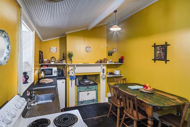 Cottage 8 — the cottage kitchen with oven, kettle and dining table