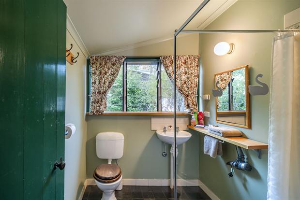 Cottage 8 — the cottage bathroom with shower, basin and heated floor